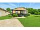 Charming single Gathering home with manicured lawn, neutral paint scheme and welcome wreath on the front door at 1513 S Rural St, Indianapolis, IN 46203
