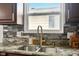 Close-up of the kitchen sink and countertop area, highlighting the stylish faucet and granite countertop at 1513 S Rural St, Indianapolis, IN 46203