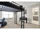 Bright bedroom featuring a modern loft bed, piano, and a view into the ensuite bathroom at 1586 Mairn Ave, Carmel, IN 46032