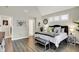 Bright bedroom with vaulted ceiling features a large window and stylish decor at 1586 Mairn Ave, Carmel, IN 46032