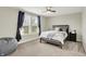 Bedroom with a large window and a ceiling fan, offering ample natural light and ventilation at 1586 Mairn Ave, Carmel, IN 46032