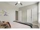 Neutral bedroom featuring carpet, ceiling fan, and a painting for a modern aesthetic at 1586 Mairn Ave, Carmel, IN 46032