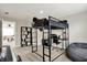 Bedroom featuring a lofted bed with workspace below, alongside a keyboard and built-in shelving at 1586 Mairn Ave, Carmel, IN 46032