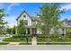 Charming two-story home with beautiful landscaping, mature trees, and a welcoming front porch at 1586 Mairn Ave, Carmel, IN 46032