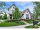Elegant two-story home with pristine lawn, a variety of trees, and charming curb appeal at 1586 Mairn Ave, Carmel, IN 46032