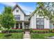 Charming two-story home with a well-manicured lawn and welcoming front porch at 1586 Mairn Ave, Carmel, IN 46032