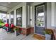 Inviting front porch with stylish seating and decorative plants, perfect for relaxing outdoors at 1586 Mairn Ave, Carmel, IN 46032
