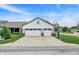 Exterior shot of a white home featuring a three-car garage and basketball hoop on the driveway at 1586 Mairn Ave, Carmel, IN 46032