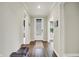 Bright hallway with sleek flooring and a modern door, leading to other rooms in the house at 1586 Mairn Ave, Carmel, IN 46032