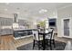 View of kitchen and eat in area, featuring an island with seating and stainless appliances at 1586 Mairn Ave, Carmel, IN 46032