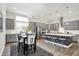 Spacious eat-in kitchen featuring an island with seating, stainless appliances, and an adjacent dining area at 1586 Mairn Ave, Carmel, IN 46032