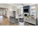 Open-concept living room with fireplace, large windows, a ceiling fan, and modern furnishings at 1586 Mairn Ave, Carmel, IN 46032