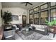Inviting covered patio with cozy seating, stylish decor, and outdoor views at 1586 Mairn Ave, Carmel, IN 46032