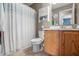 Functional bathroom featuring a vanity with storage, a shower with a white curtain, and neutral tones at 1605 Perry Commons Blvd, Indianapolis, IN 46217