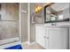 Well-maintained bathroom featuring a glass-enclosed shower and a vanity with ample storage space at 1605 Perry Commons Blvd, Indianapolis, IN 46217