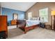 Comfortable primary bedroom with vaulted ceilings, large windows, and a relaxing atmosphere at 1605 Perry Commons Blvd, Indianapolis, IN 46217