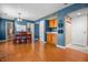 Bright dining room with a table and chairs, wood flooring, and natural light at 1605 Perry Commons Blvd, Indianapolis, IN 46217