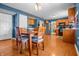Bright dining room with a table and chairs, wood flooring, and natural light at 1605 Perry Commons Blvd, Indianapolis, IN 46217