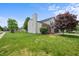 Well-maintained two-story home with a manicured lawn, attractive landscaping, and a welcoming facade at 1605 Perry Commons Blvd, Indianapolis, IN 46217