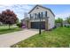 Charming two-story home featuring a two-car garage, basketball hoop, and a well-manicured lawn at 1605 Perry Commons Blvd, Indianapolis, IN 46217
