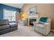 Inviting living room with a fireplace, comfortable seating, and plenty of natural light at 1605 Perry Commons Blvd, Indianapolis, IN 46217