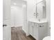 A bathroom featuring a vanity, mirror, and towel racks at 1612 Paula Dr, Columbus, IN 47201