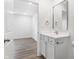 Bright bathroom featuring a single vanity, large mirror, and modern fixtures at 1612 Paula Dr, Columbus, IN 47201