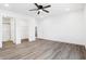 Spacious bedroom with ceiling fan, walk-in closet, ensuite bathroom and neutral color palette at 1612 Paula Dr, Columbus, IN 47201