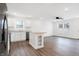 Open-concept kitchen featuring white cabinets, and a kitchen island at 1612 Paula Dr, Columbus, IN 47201