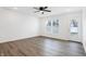 Bright living room featuring a door to the exterior and stylish gray wood flooring at 1612 Paula Dr, Columbus, IN 47201