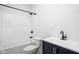 This bright bathroom offers a shower-tub combo and a classic vanity with a black faucet at 1717 Carrollton Ave, Indianapolis, IN 46202