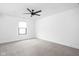 Minimalist bedroom offering soft carpeting, neutral paint and ample natural light at 1717 Carrollton Ave, Indianapolis, IN 46202