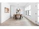 Dining room featuring a stylish light fixture, neutral color palette, and hardwood flooring at 1717 Carrollton Ave, Indianapolis, IN 46202