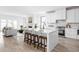 Stylish kitchen with an island, bar stool seating, modern appliances, and an open floor plan at 1717 Carrollton Ave, Indianapolis, IN 46202