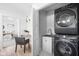 Well-organized laundry room featuring modern appliances and built-in shelving at 1717 Carrollton Ave, Indianapolis, IN 46202
