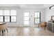 Bright living room with light hardwood floors, neutral paint, and lots of natural light at 1717 Carrollton Ave, Indianapolis, IN 46202
