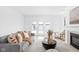 Bright living room with a comfortable couch, fireplace, and access to the outdoor space at 1717 Carrollton Ave, Indianapolis, IN 46202