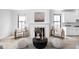 Living room featuring a fireplace with mantel, chairs, and decor at 1717 Carrollton Ave, Indianapolis, IN 46202