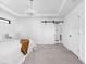 Cozy main bedroom showcasing a tray ceiling, walk in closet, and neutral decor at 1717 Carrollton Ave, Indianapolis, IN 46202