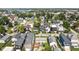 An aerial view showing the neighborhood featuring tree-lined streets and a variety of home styles at 1717 Carrollton Ave, Indianapolis, IN 46202