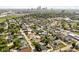 Aerial view of a tree-filled neighborhood, showcasing proximity to the city skyline at 1717 Carrollton Ave, Indianapolis, IN 46202