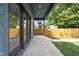 Covered patio with modern railings offers a stylish outdoor living space at 1717 Carrollton Ave, Indianapolis, IN 46202