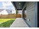 Covered patio is perfect for outdoor entertaining in this backyard with privacy fence at 1717 Carrollton Ave, Indianapolis, IN 46202