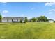 Well-maintained backyard featuring a deck, spacious lawn, shed and mature trees providing a serene outdoor space at 18005 Gasparilla Ct, Westfield, IN 46062