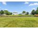 Expansive grassy backyard with a classic wooden fence, perfect for recreation and relaxation at 18005 Gasparilla Ct, Westfield, IN 46062