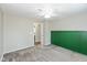 Bedroom with soft carpet, green accent wall, and bright window with ample light at 18005 Gasparilla Ct, Westfield, IN 46062