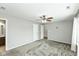 Bright bedroom features soft carpet, neutral walls, ceiling fan, and ample closet space at 18005 Gasparilla Ct, Westfield, IN 46062