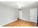 Bedroom featuring hardwood floors, neutral walls, ceiling fan, closet, and a bright window at 18005 Gasparilla Ct, Westfield, IN 46062