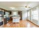Well-lit kitchen features stainless steel appliances, wooden cabinets, and center island at 18005 Gasparilla Ct, Westfield, IN 46062