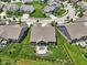 Aerial view of a well-maintained home with a fenced backyard, patio, and lush landscaping in a suburban neighborhood at 18998 Beverly Shones Ln, Noblesville, IN 46062